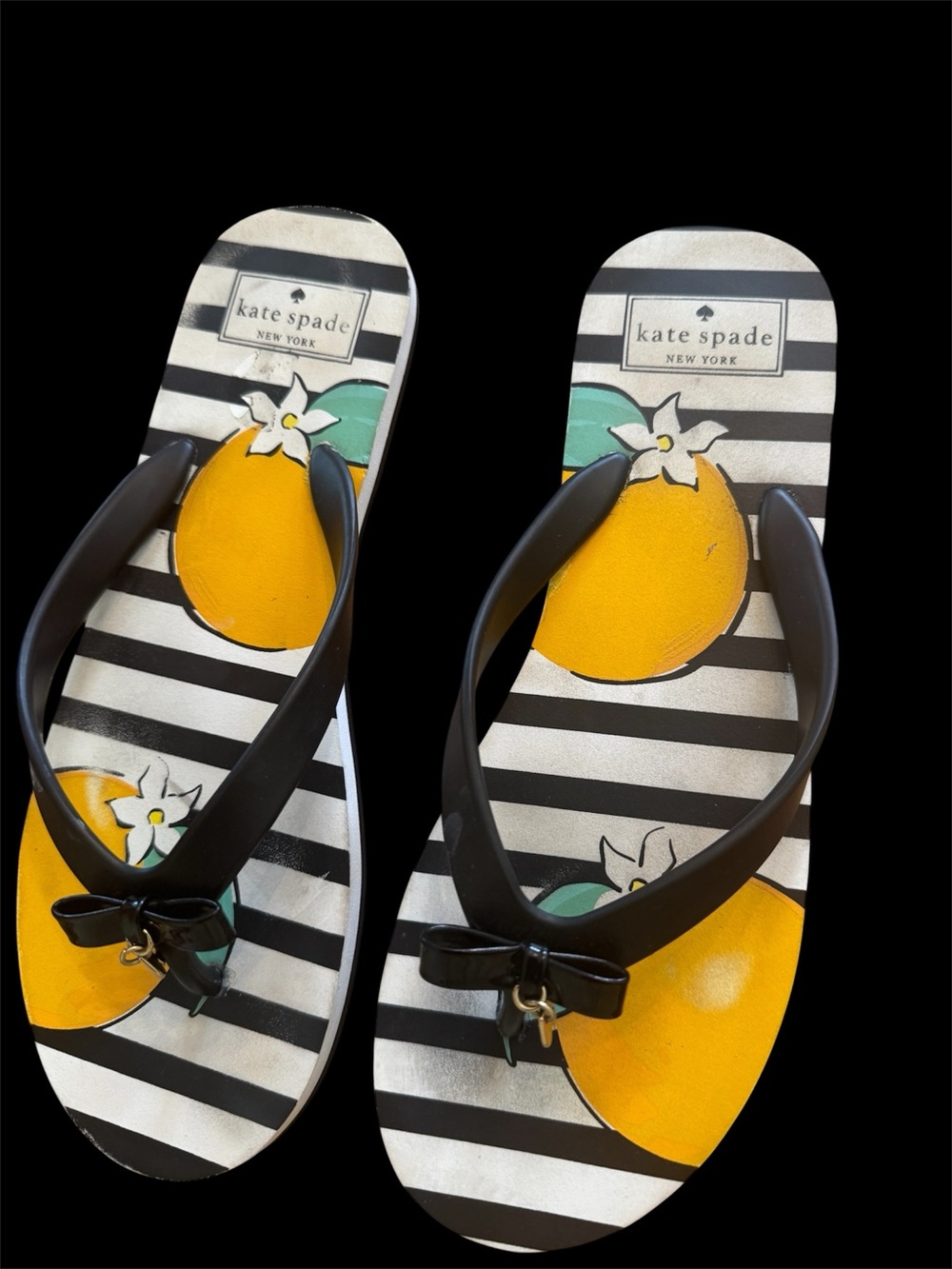 Kate Spade New York women size 9 Black Stripe Flip Flops with Yellow used once